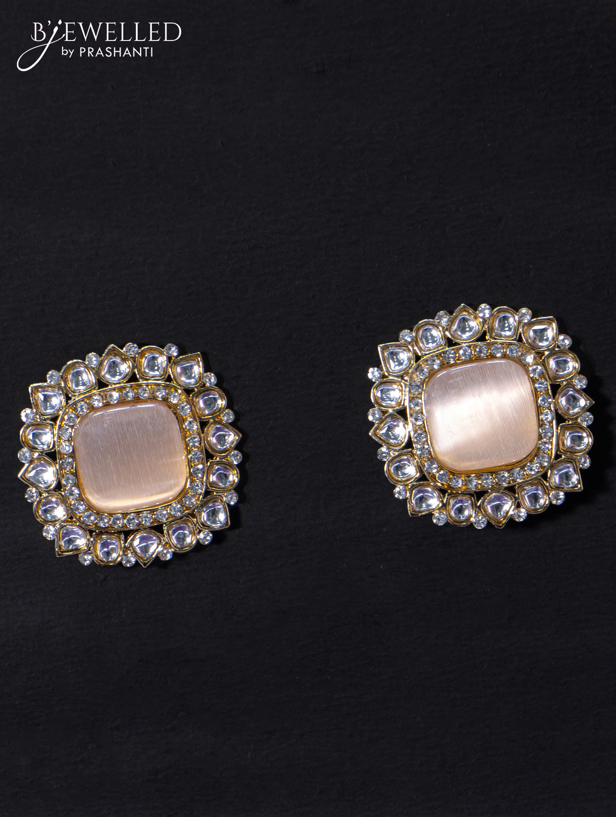 Light weight earrings with cz and peach stone