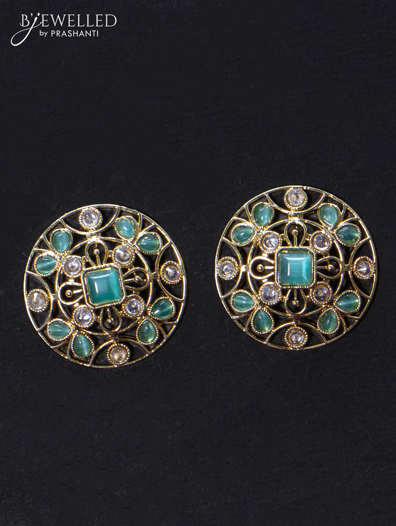 Light weight floral design earrings with cz and light blue stone