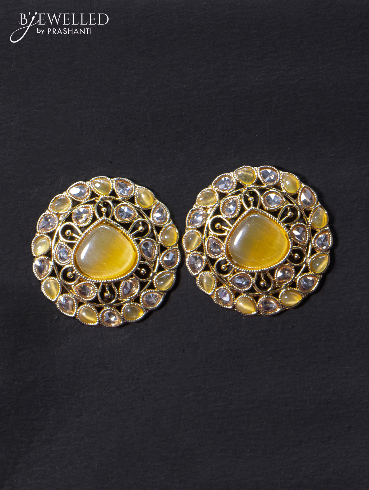 Light weight earrings with cz and yellow stone