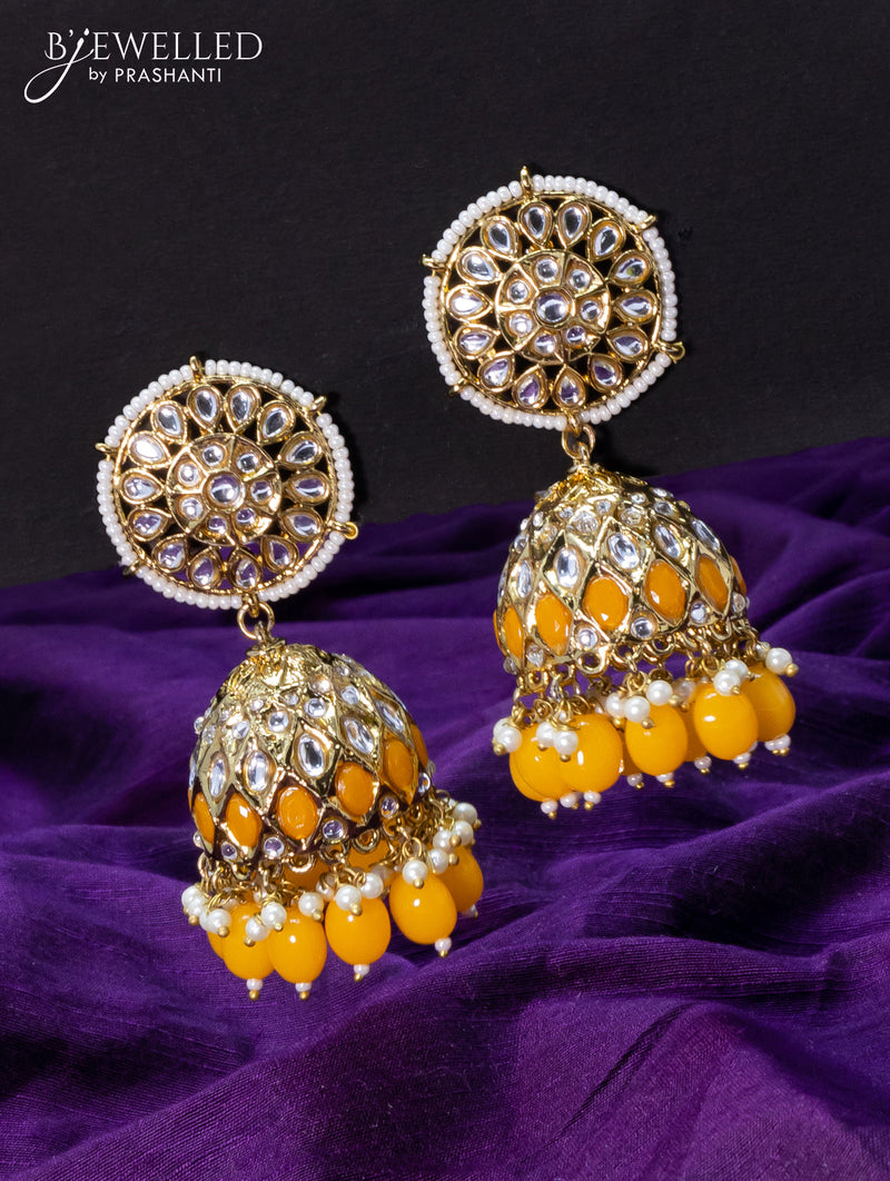 Light weight jhumkas yellow and cz stone with beads hangings