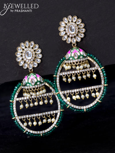 Light weight earrings with kundan stone and green crystal beads