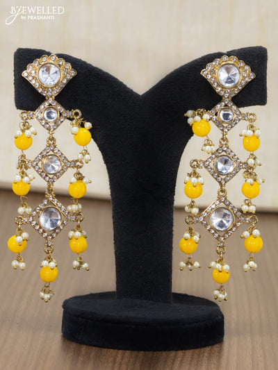 Light weight earrings with cz stone and yellow beads hangings