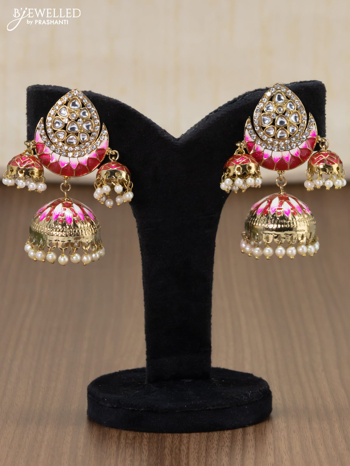 Light weight jhumka with red minakari and pearl hangings