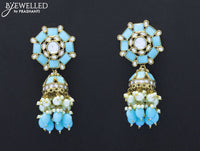Dangler jhumkas with light blue stone and hangings