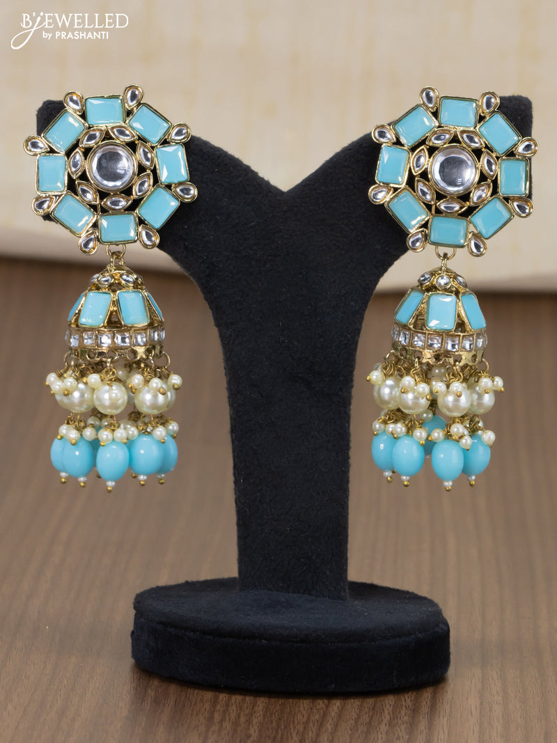 Dangler jhumkas with light blue stone and hangings