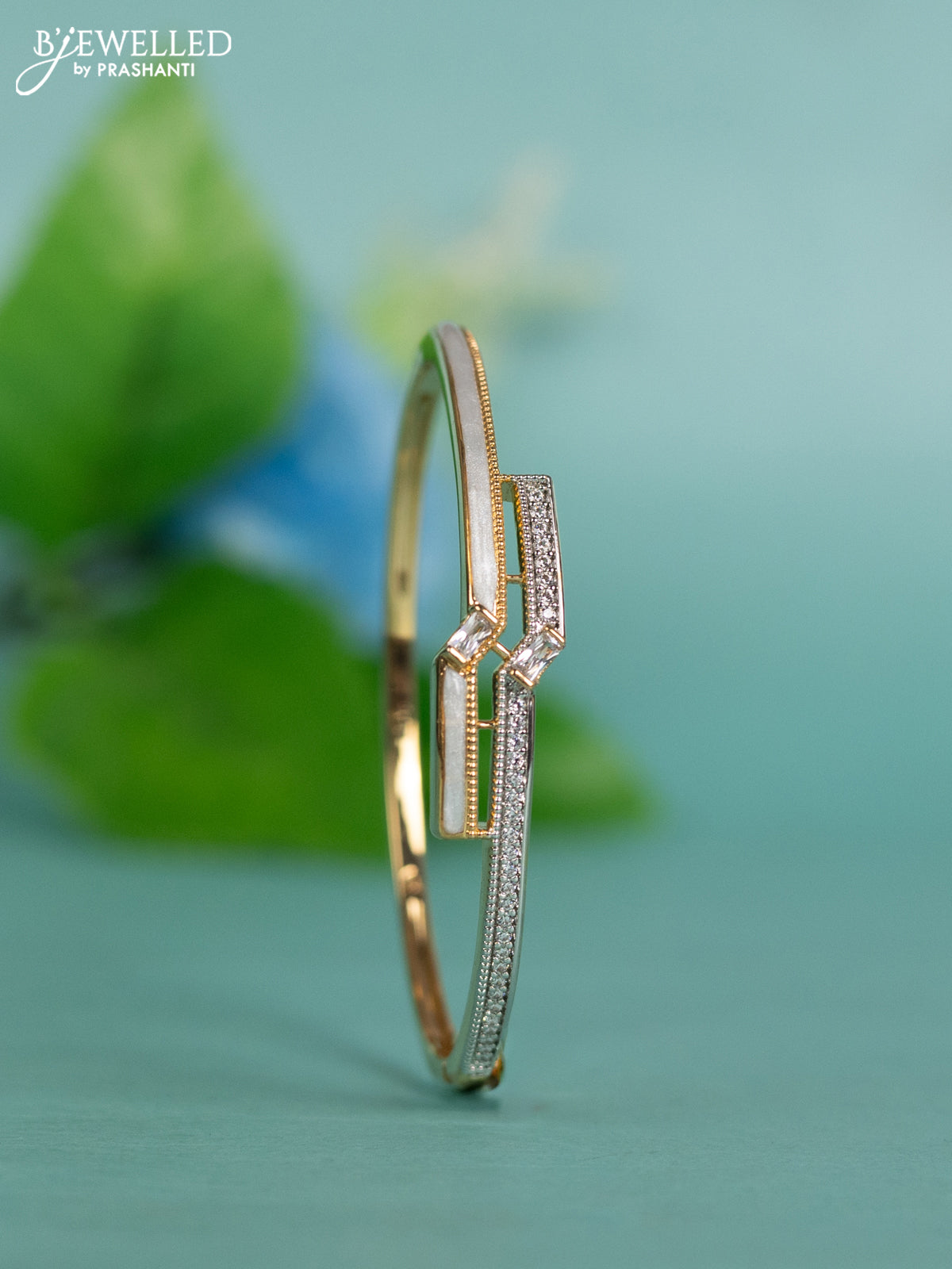 Zircon bracelet with white enamel and cz stones in gold finish