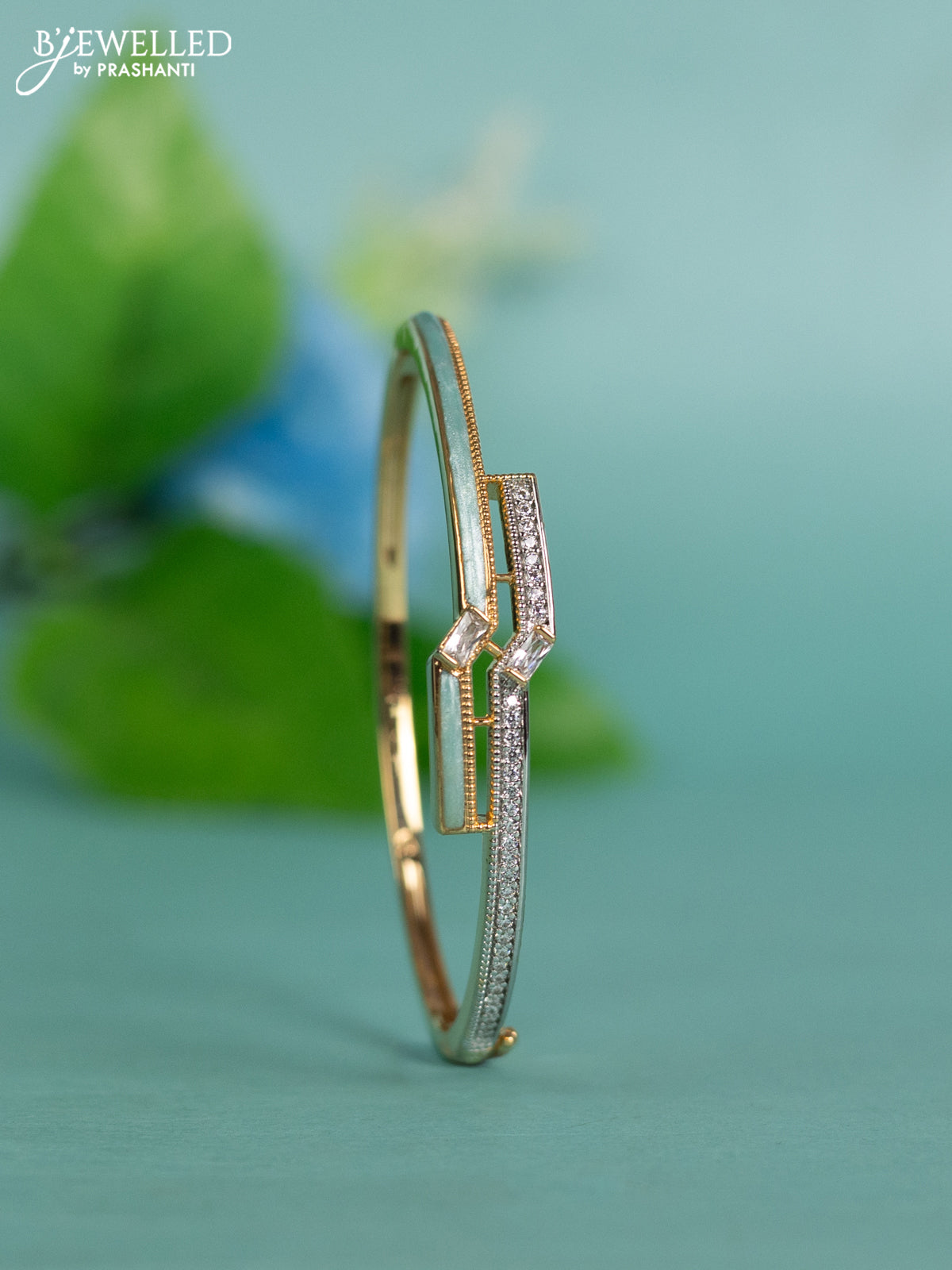 Zircon bracelet with ice blue enamal and cz stones in gold finish