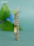 Zircon bracelet with ice blue enamal and cz stones in gold finish