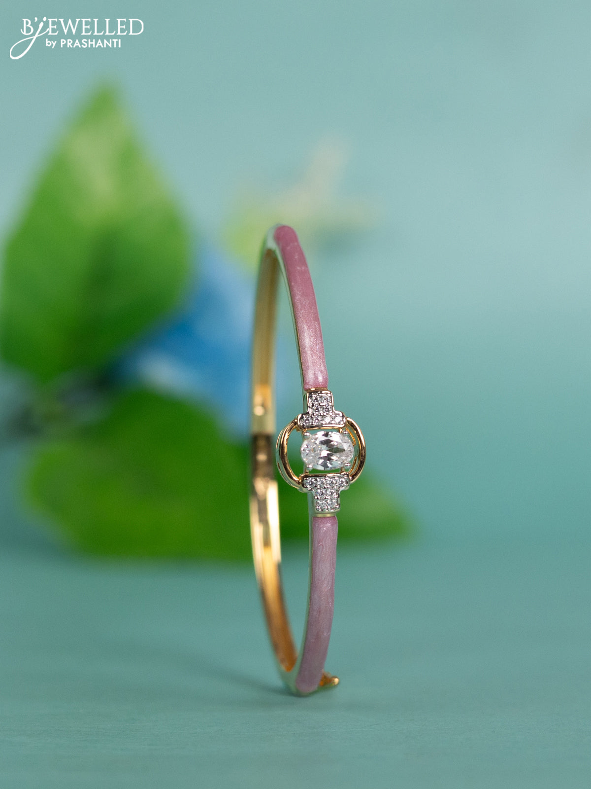 Zircon bracelet with light pink enamal and cz stones in gold finish