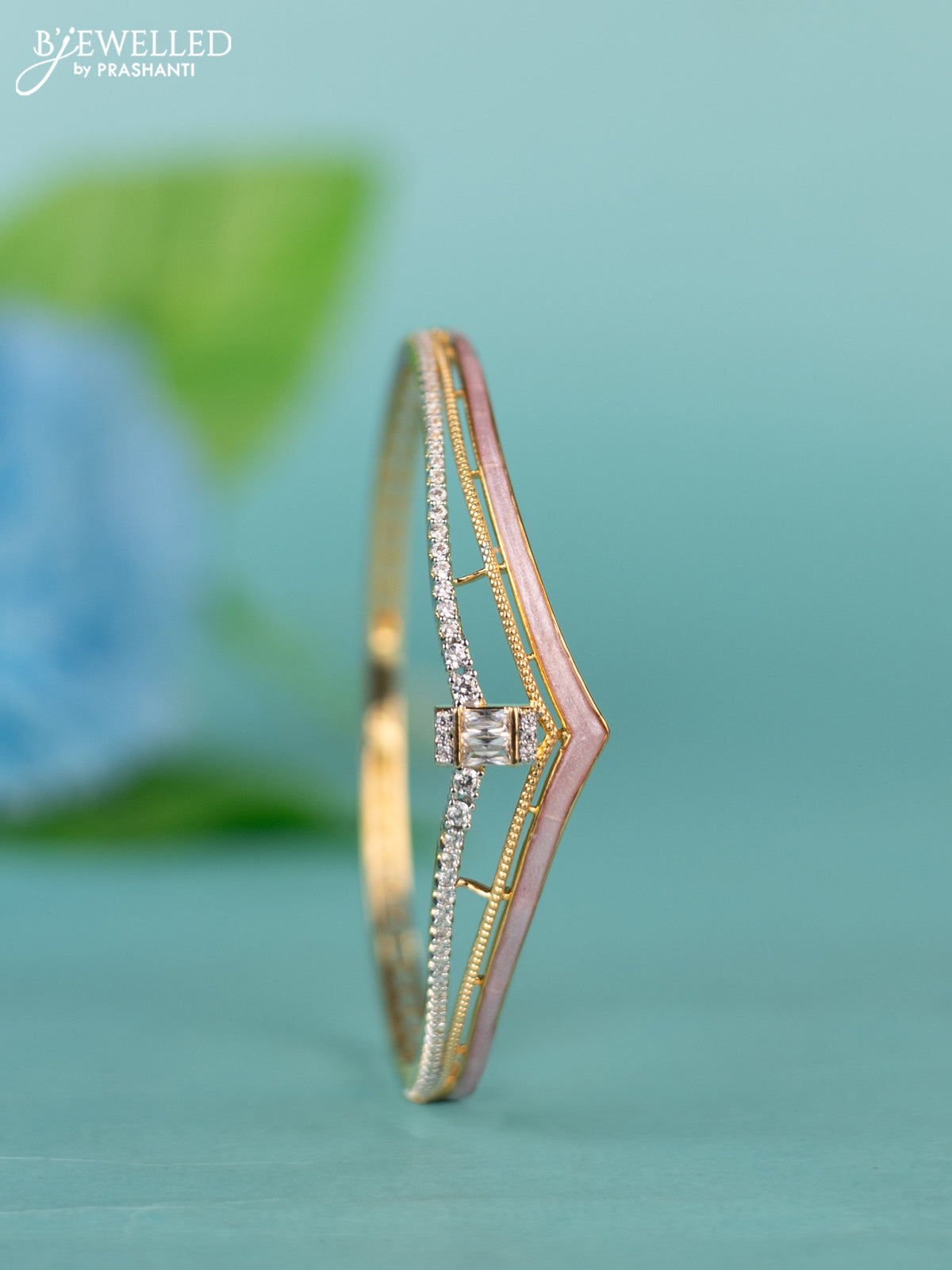 Zircon bracelet with light pink enamal and cz stones in gold finish