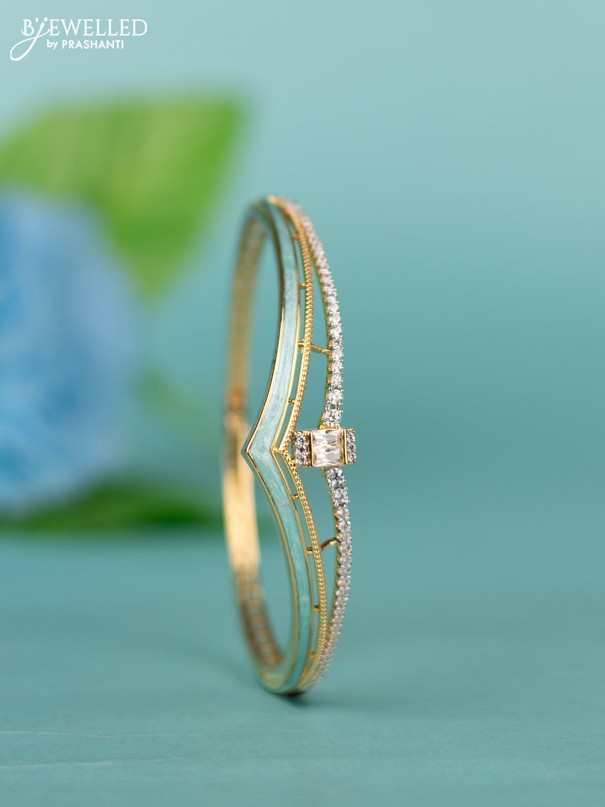 Zircon bracelet with ice blue enamal and cz stones in gold finish