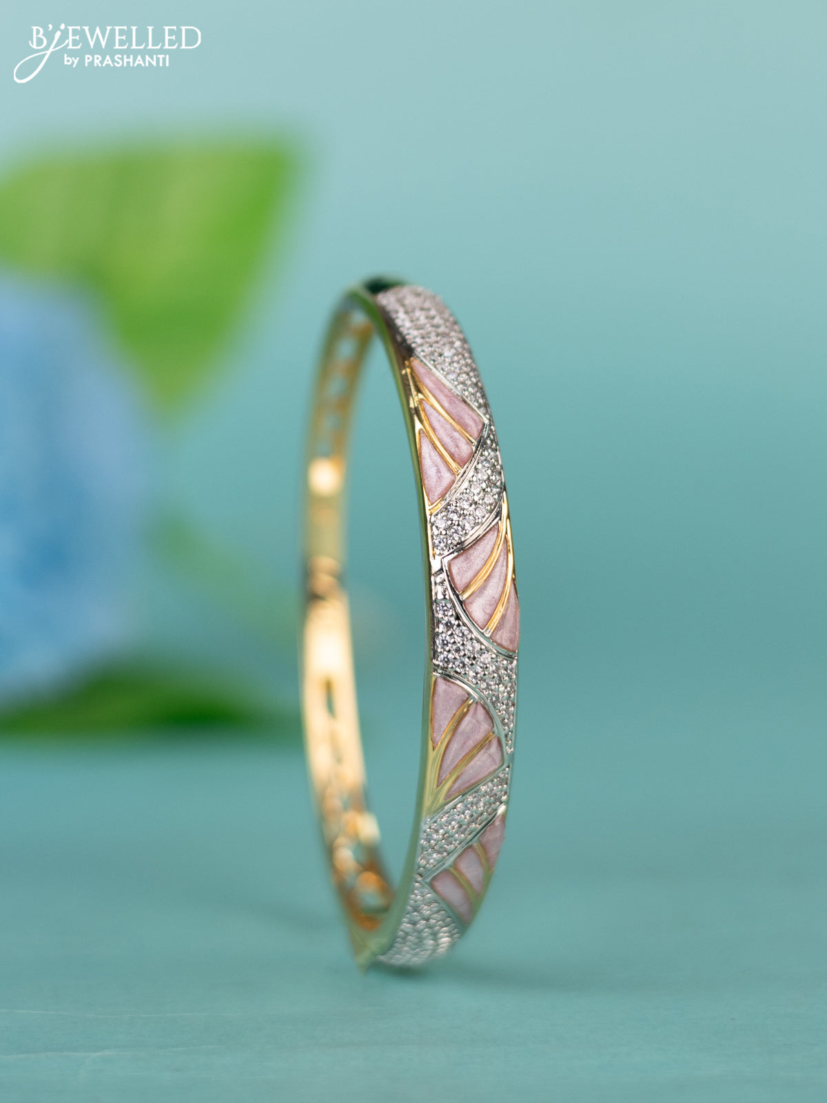 Zircon bracelet with light pink enamal and cz stones in gold finish