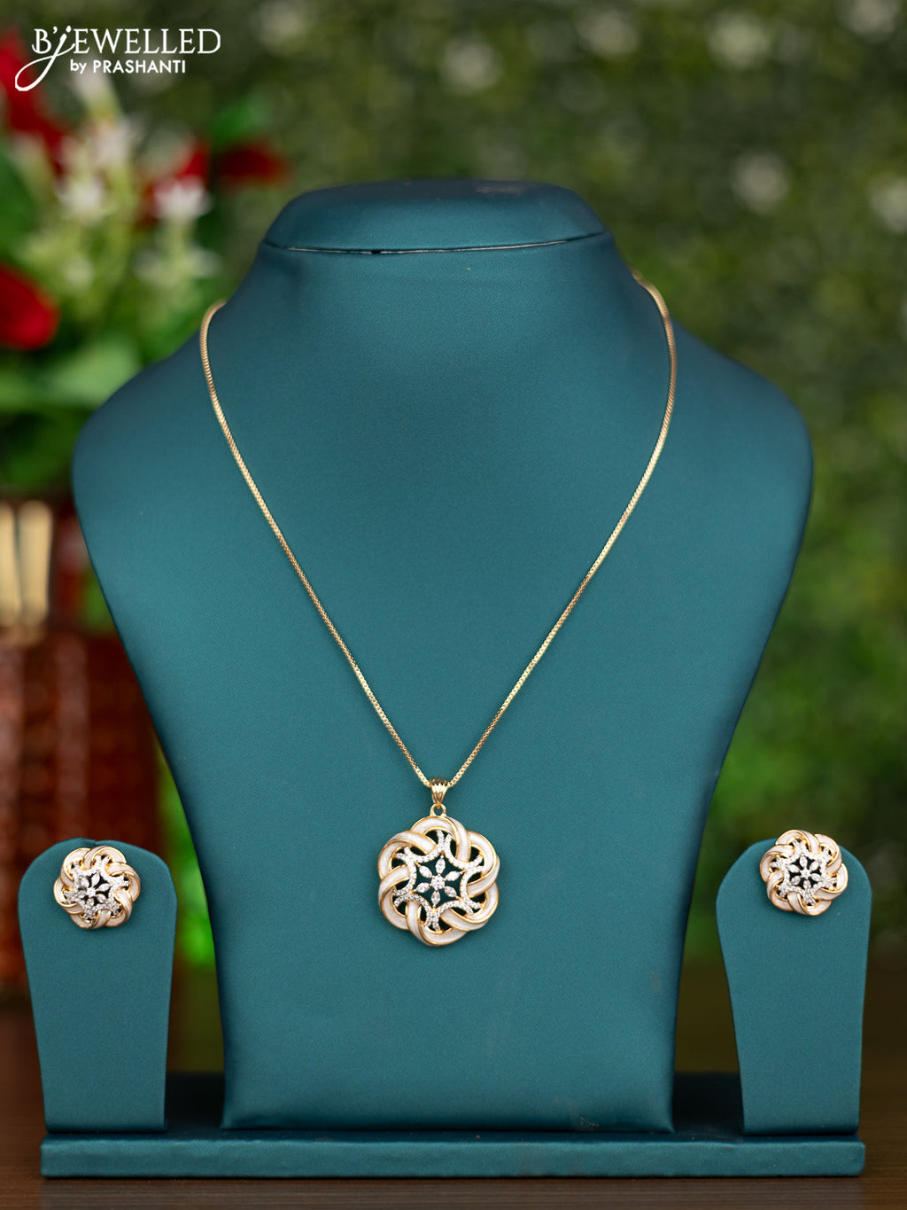 Gold chain with white enamel and cz stones pendant