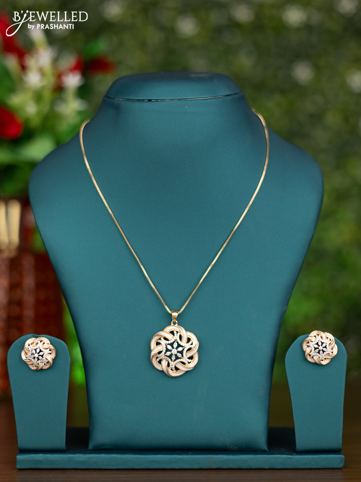 Gold chain with white enamel and cz stones pendant