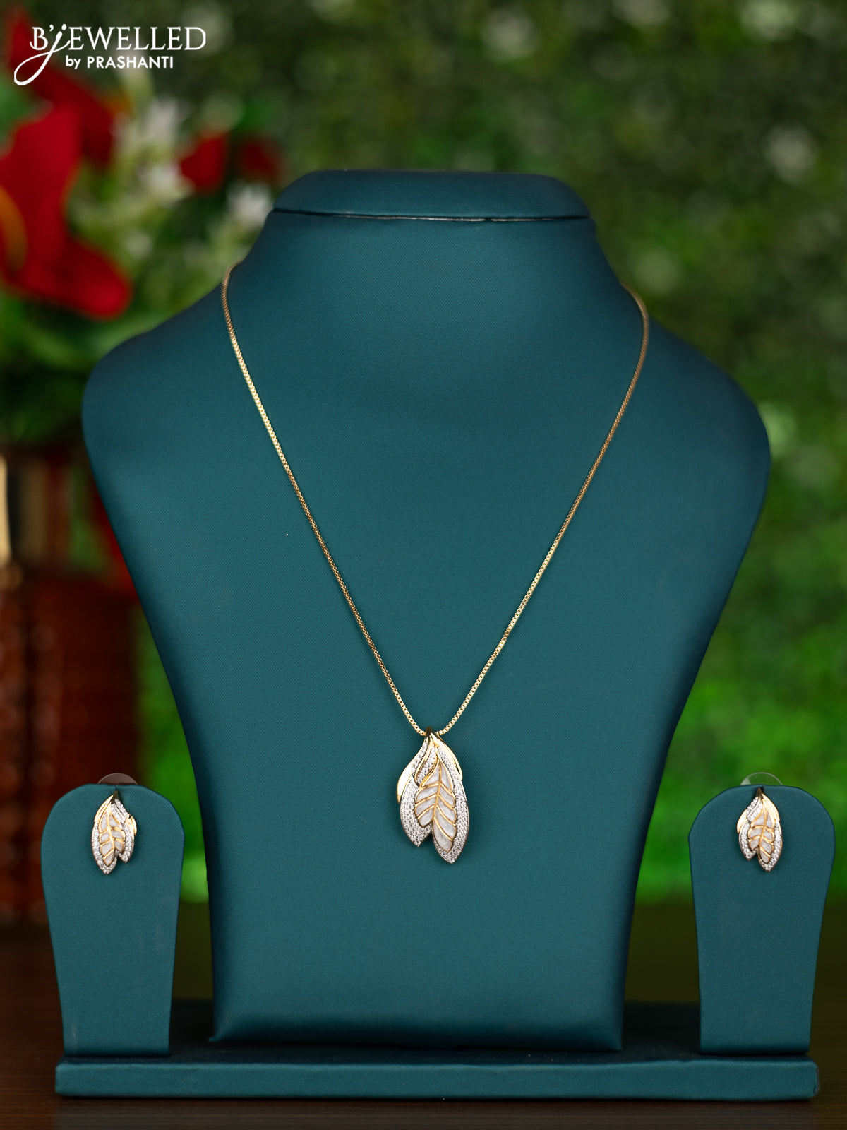 Gold chain leaf design with white enamel and cz stones pendant