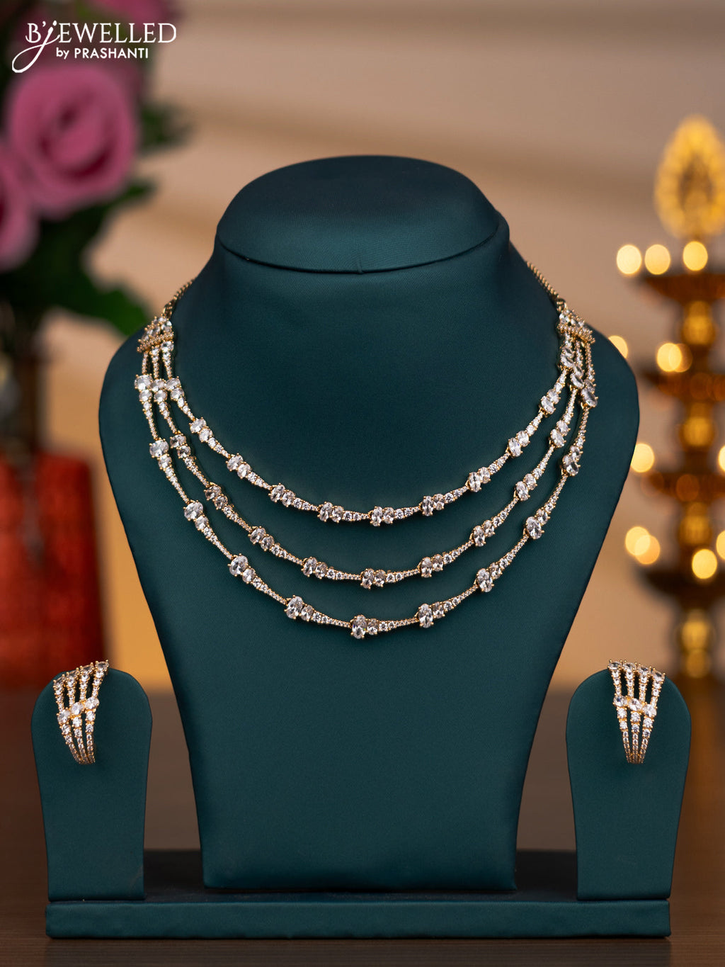 Zircon triple layer necklace with cz stones in gold finish