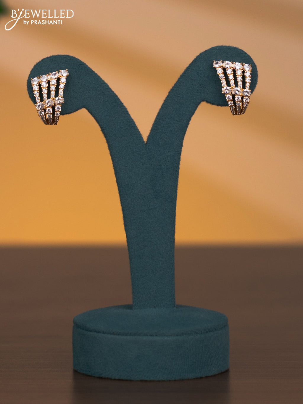 Zircon triple layer necklace with cz stones in gold finish