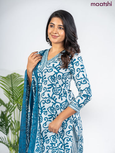 Semi cotton salwar suit grey and peacock blue with allover batik prints & sequin beaded work v neck pattern and straight cut pant & dupatta
