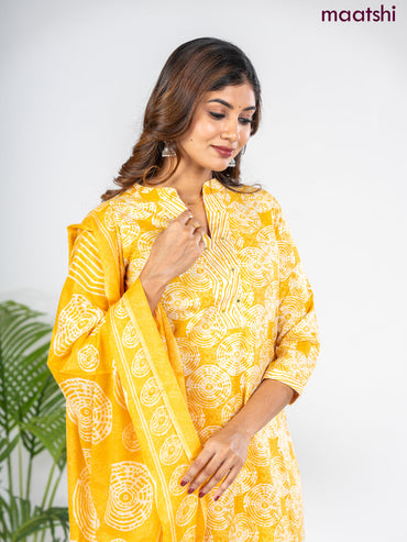 Semi cotton salwar suit mustard yellow and off white with allover prints & embroidery mirror work neck pattern and straight cut pant & dupatta
