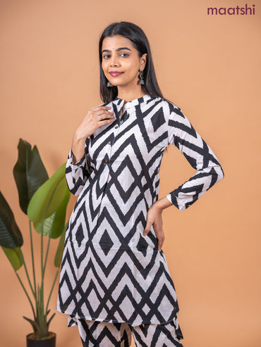 Cotton co-ord set off white and black with allover ikat weaves & simple neck pattern and straight cut pant
