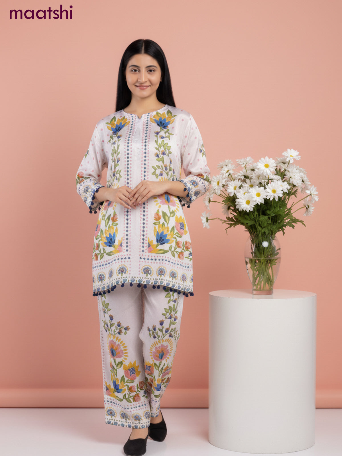 Short co-ord set mild peach shade with allover prints & simple neck pattern and straight cut pant