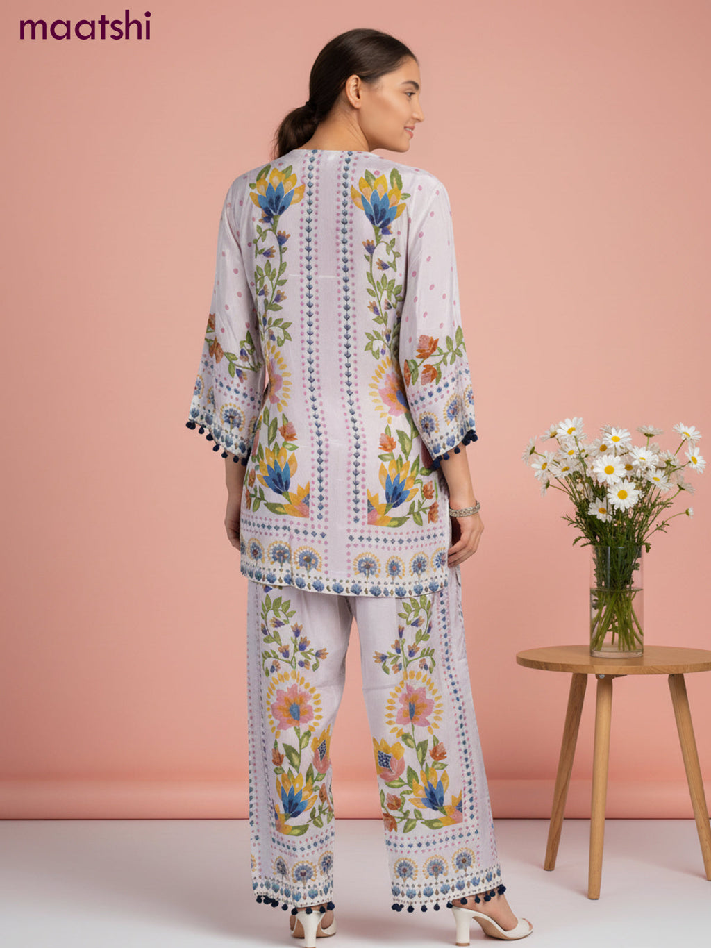 Short co-ord set mild peach shade with allover prints & simple neck pattern and straight cut pant