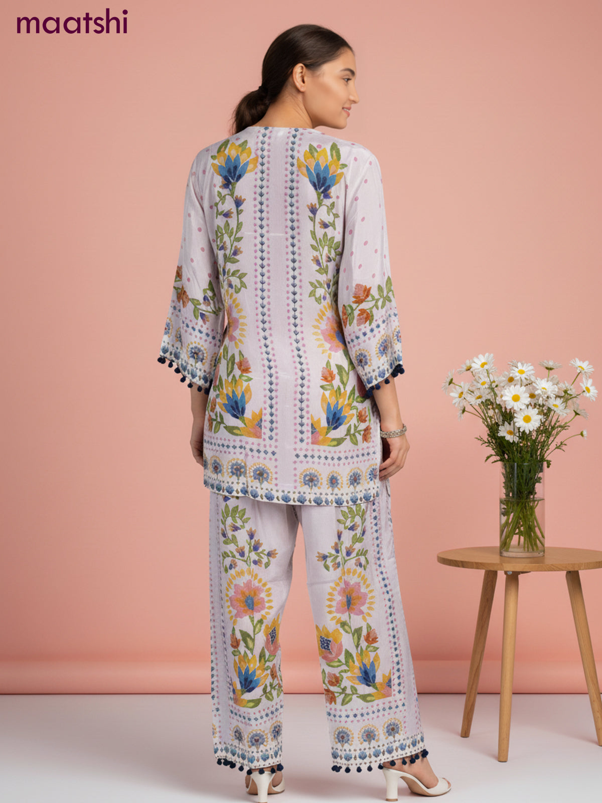 Short co-ord set mild peach shade with allover prints & simple neck pattern and straight cut pant