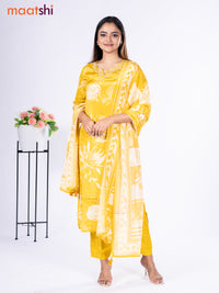 Crepe silk salwar suit mustard yellow with placement prints & beaded work neck pattern and straight cut pant & dupatta