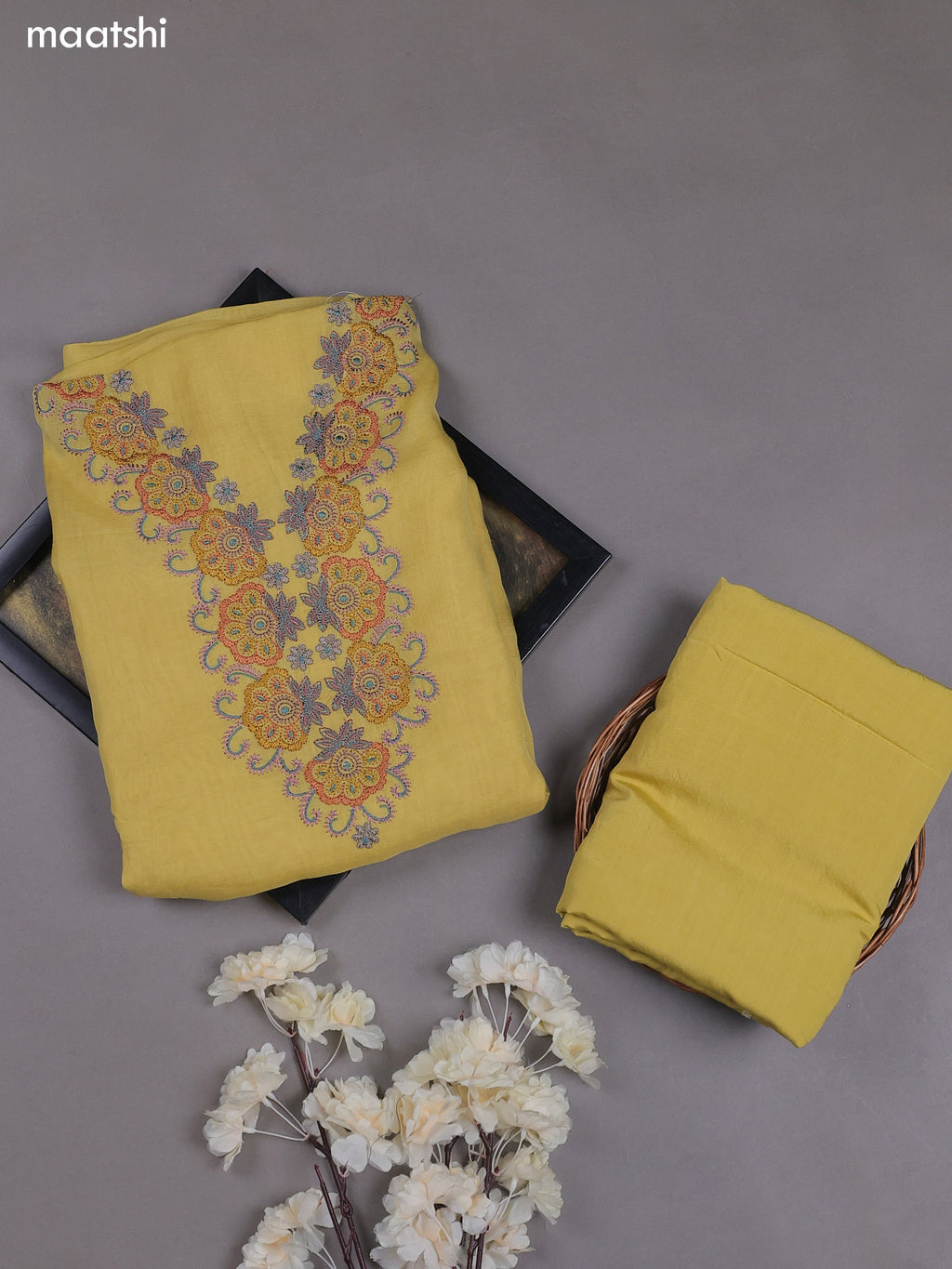 Pale Yellow Mul Chanderi Dress Materials With Embroidery Work Neck Pattern