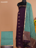 Deep Purple and Pastel Green Semi Silk Cotton Dress Material With Zari Buttas And Bottom & Dupatta