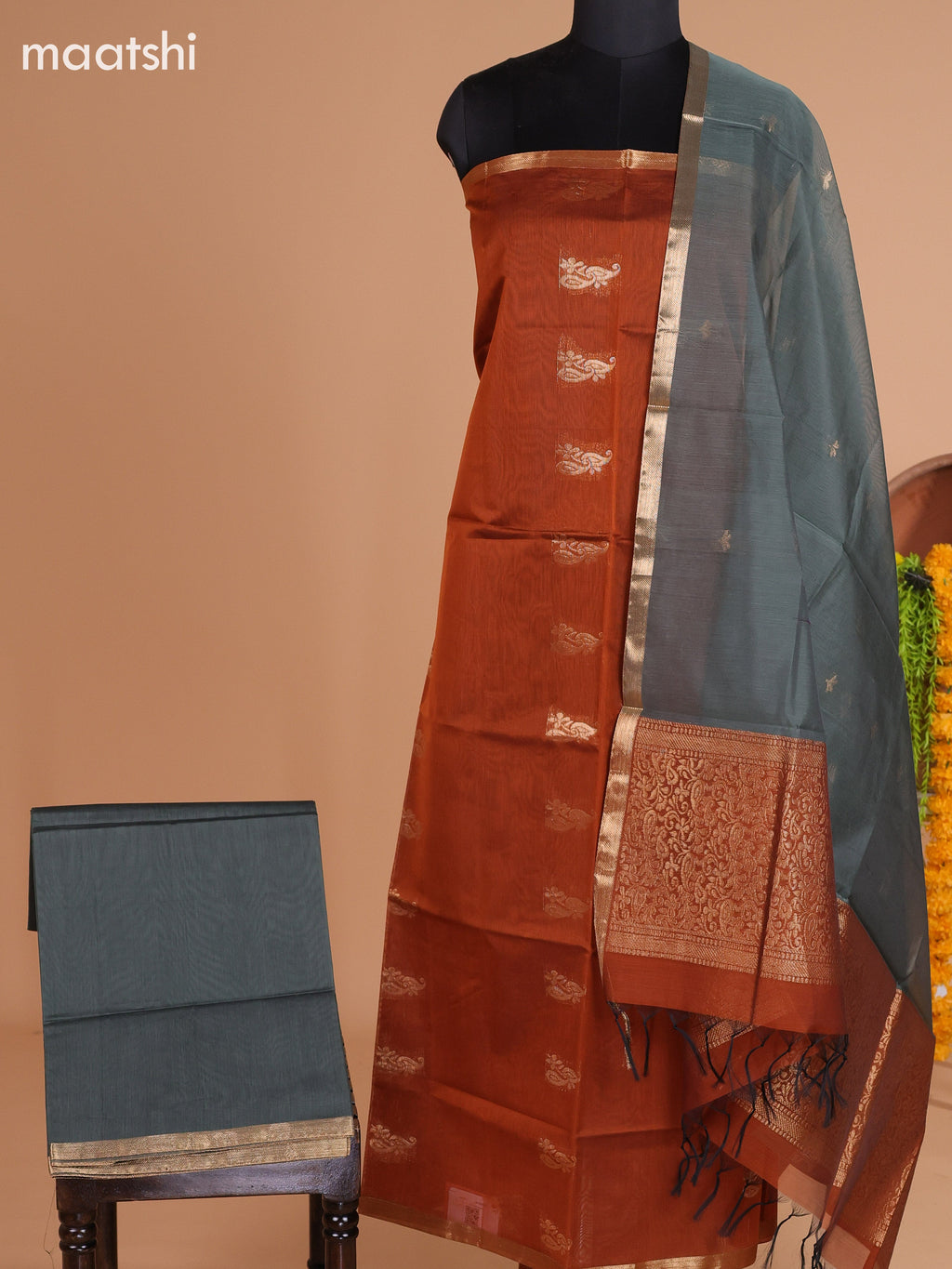 Dark Rust and Greyish Green Semi Silk Cotton Dress Material With Zari Buttas And Bottom & Dupatta