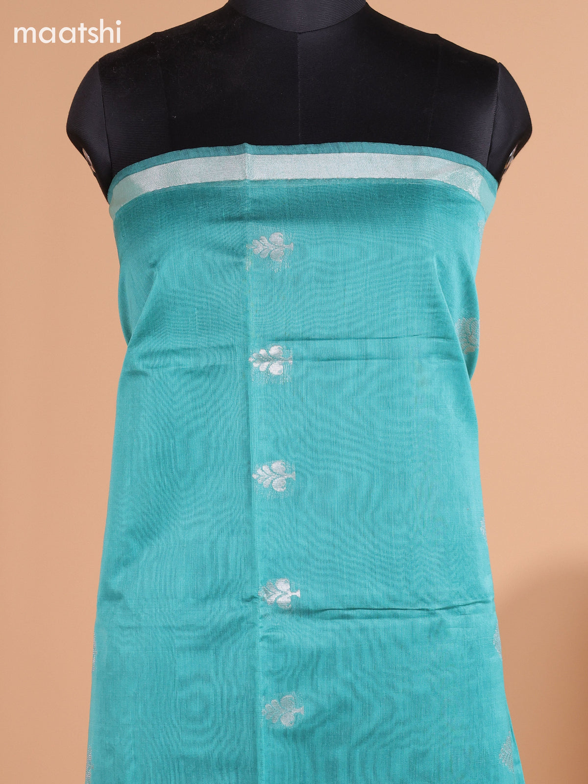 Pastel Green and Black Semi Silk Cotton Dress Material With Zari Buttas And Bottom & Dupatta