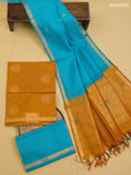 Mustard Yellow and Teal Blue Kora Silk Cotton Dress Material With Zari Buttas