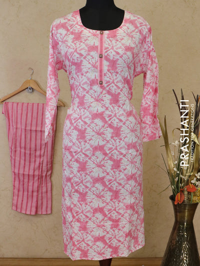Slub cotton readymade kurti off white and pink with allover batik prints simple neck work and straight cut pant