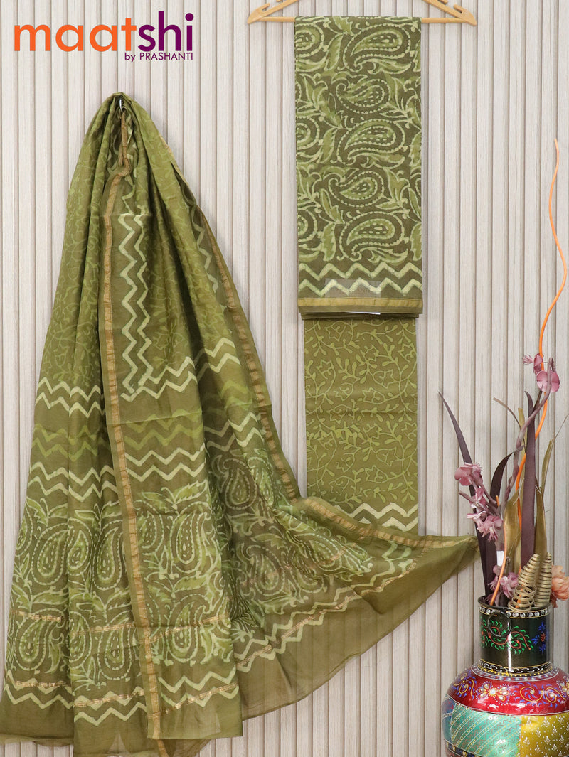Pure chanderi dress material sap green shade with allover prints and small zari woven border