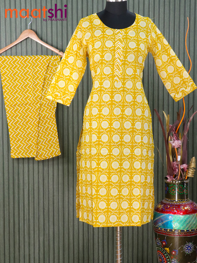 Cotton readymade kurti mustard yellow with allover floral prints & mirror work neck pattern and straight cut pant