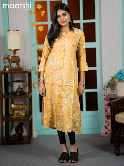 Rayon readymade A-line kurti mustard shade with allover floral prints & simple neck pattern without pant