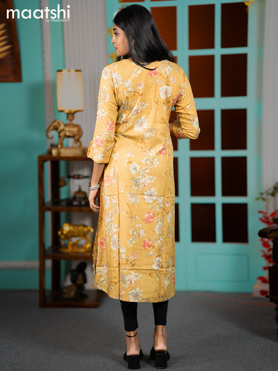 Rayon readymade A-line kurti mustard shade with allover floral prints & simple neck pattern without pant