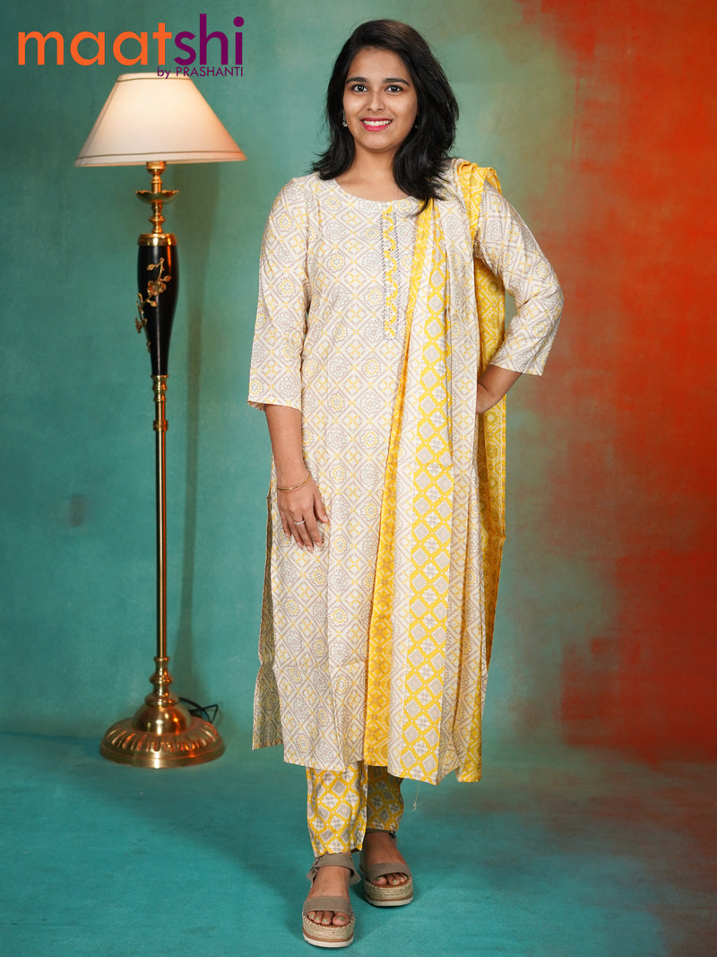 Chanderi readymade kurti set off white and yellow shade with allover bandhani prints & simple neck pattern and straight cut pant & dupatta