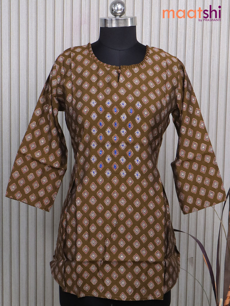 Muslin readymade short kurti dark mustard with allover prints & simple neck pattern without pant