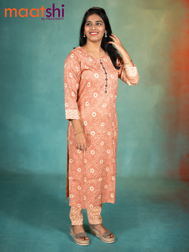 Rayon readymade kurti pastel peach and cream with allover prints & embroidery work neck pattern and straight cut pant