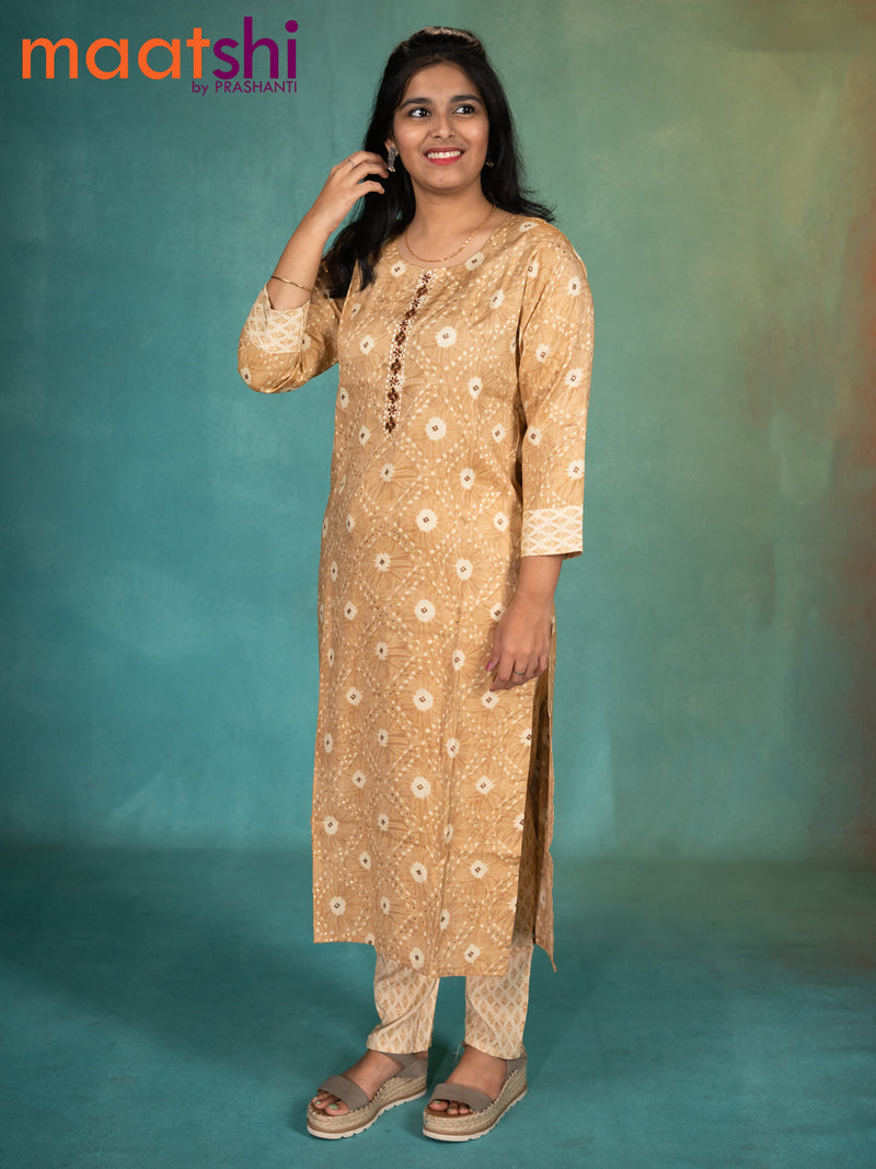 Rayon readymade kurti beige and cream with allover prints & embroidery work neck pattern and straight cut pant