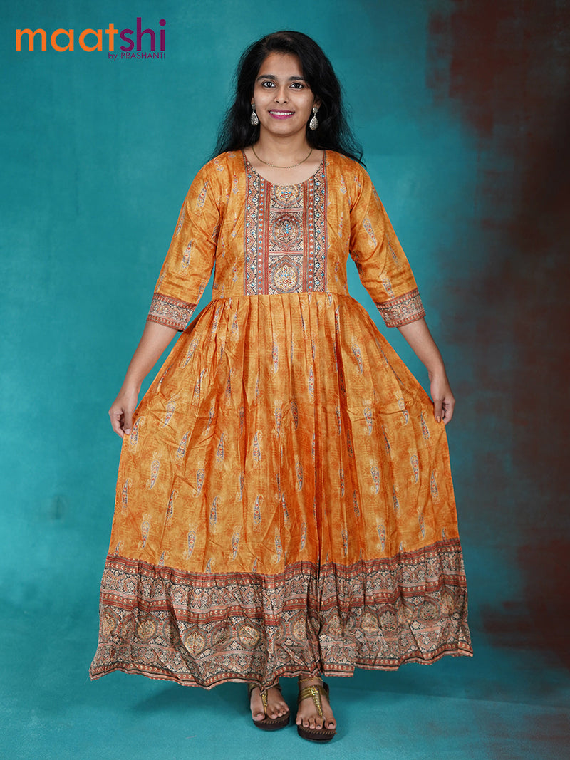 Muslin readymade floor lenght kurti mustard yellow with paisley prints & sequin work neck pattern without pant