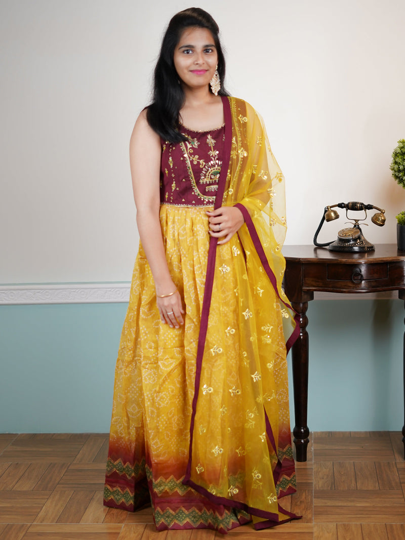 Chanderi floor length dress maroon and yellow with embroidery mirror work neck pattern & bandhani prints and sequence work dupatta & attached sleeve