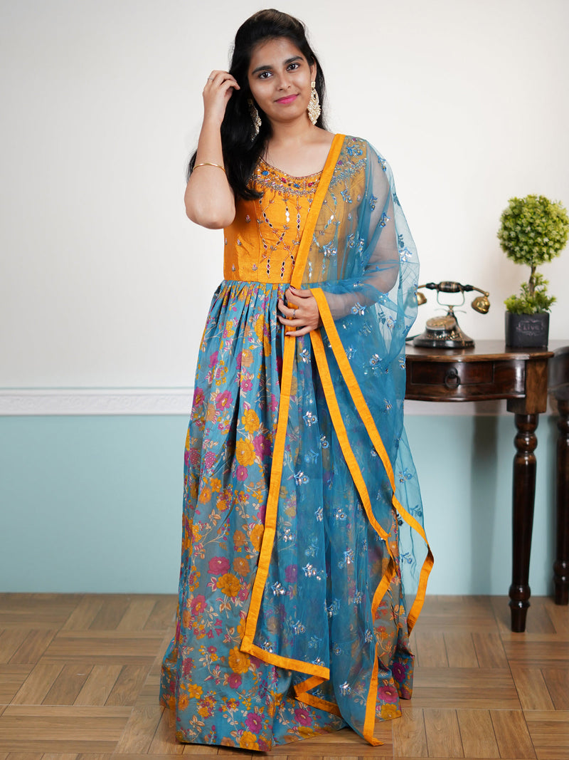 Raw silk floor length dress mustard yellow and blue shade with embroidery mirror work neck pattern & allover prints and sequence work dupatta & attached sleeve