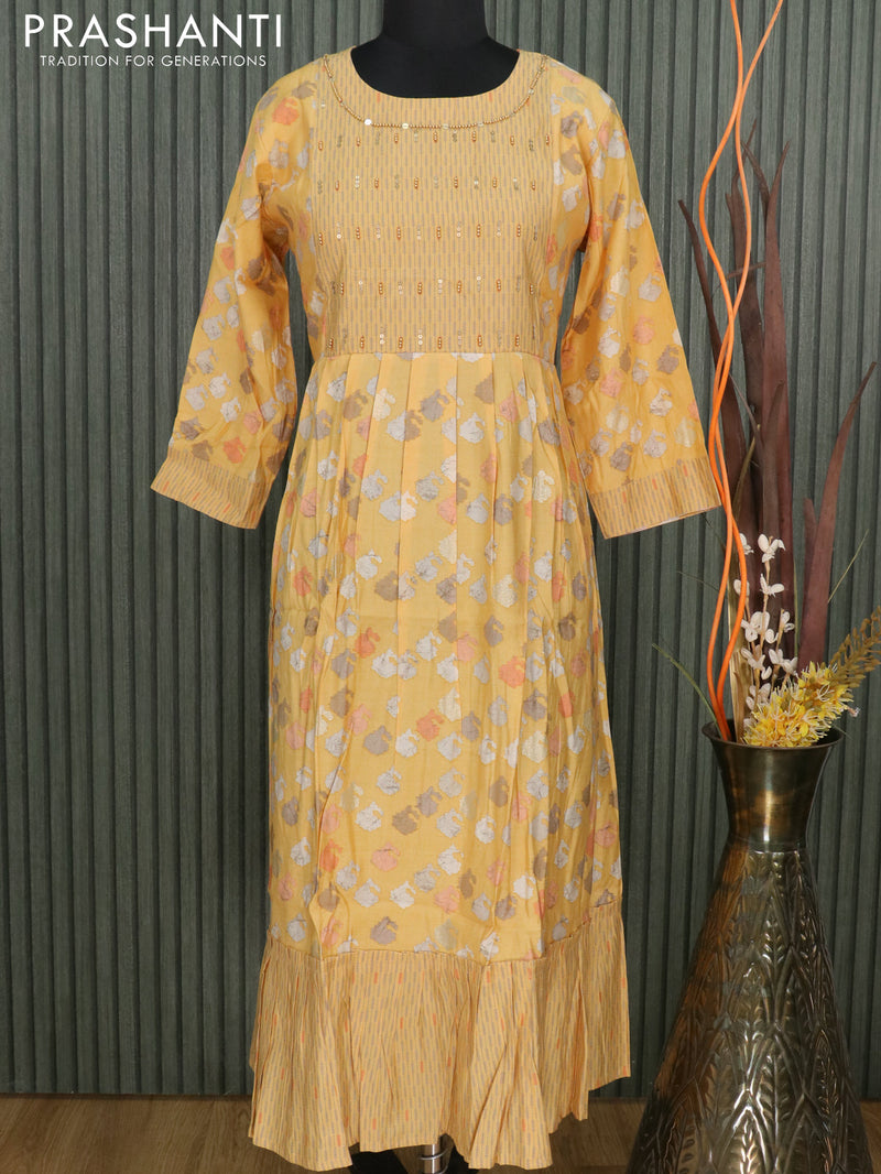 Muslin readymade umbrella kurti yellow shade with allover prints & beaded neck pattern without pant