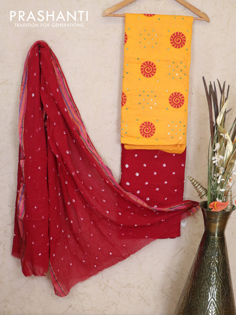 Cotton dress material yellow and maroon with allover embroided work top & bandhani prints and cotton dupatta