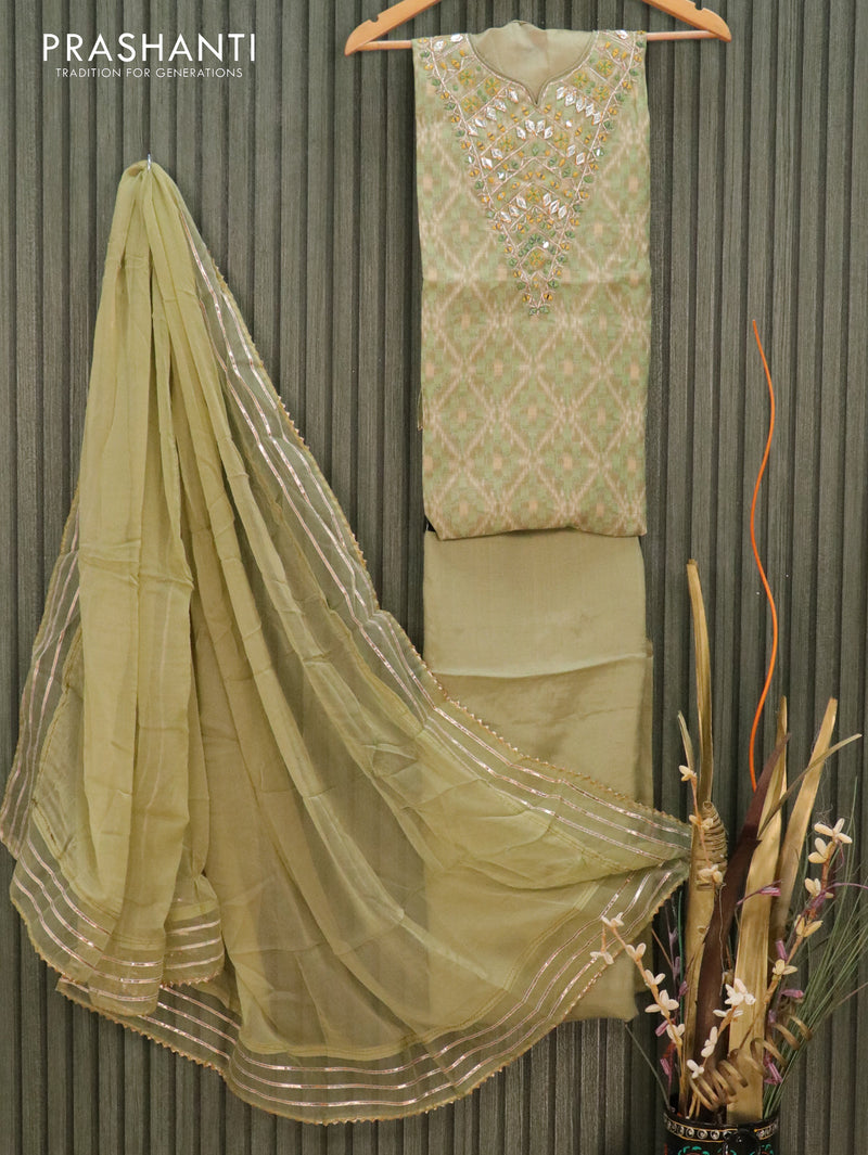 Semi stitched chanderi dress material mehendi green and elaichi green shade with allover ikat prints & mirror work neck pattern and chiffon dupatta